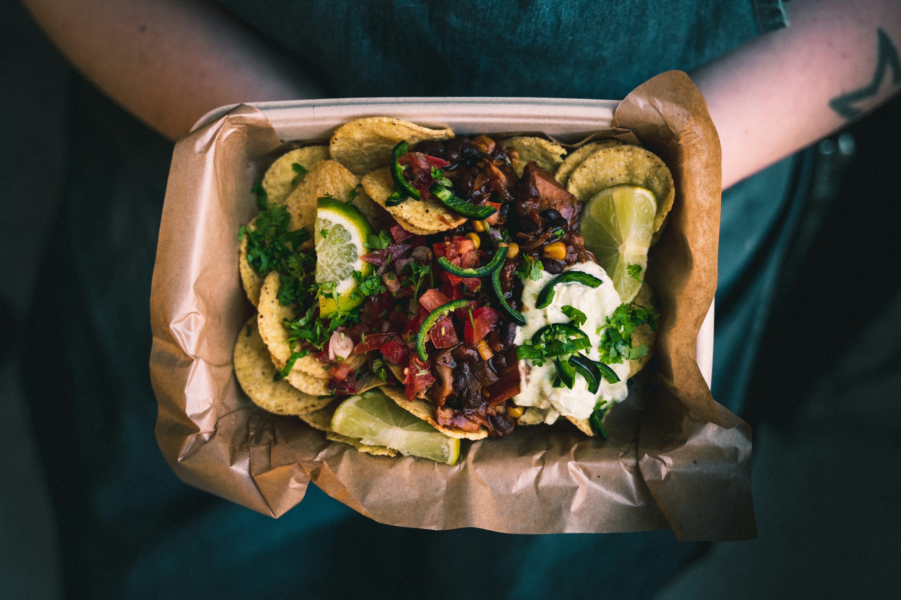 Colorful tacos arranged in a takeout tray
